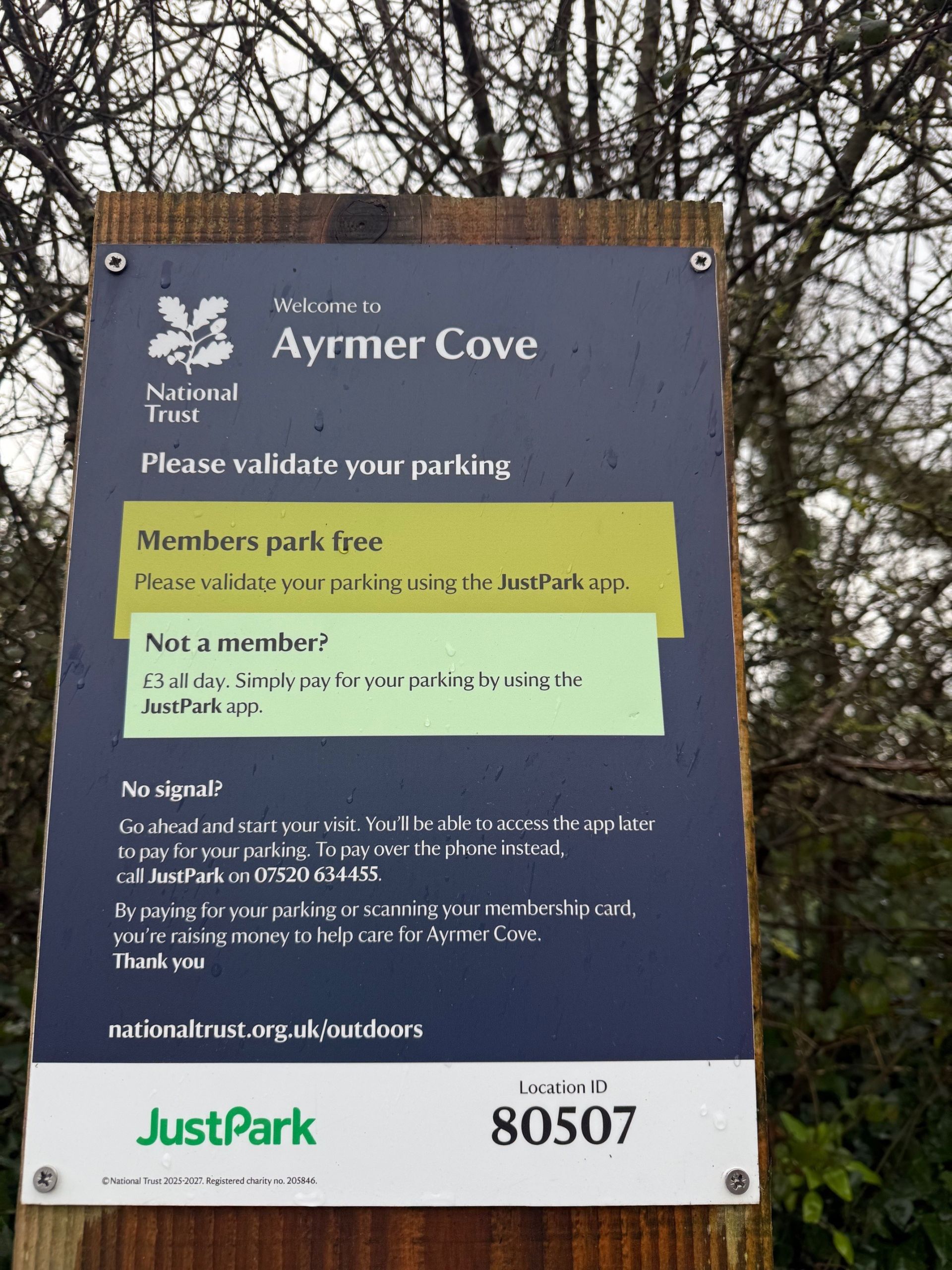 Car park sign showing how to pay or validate parking